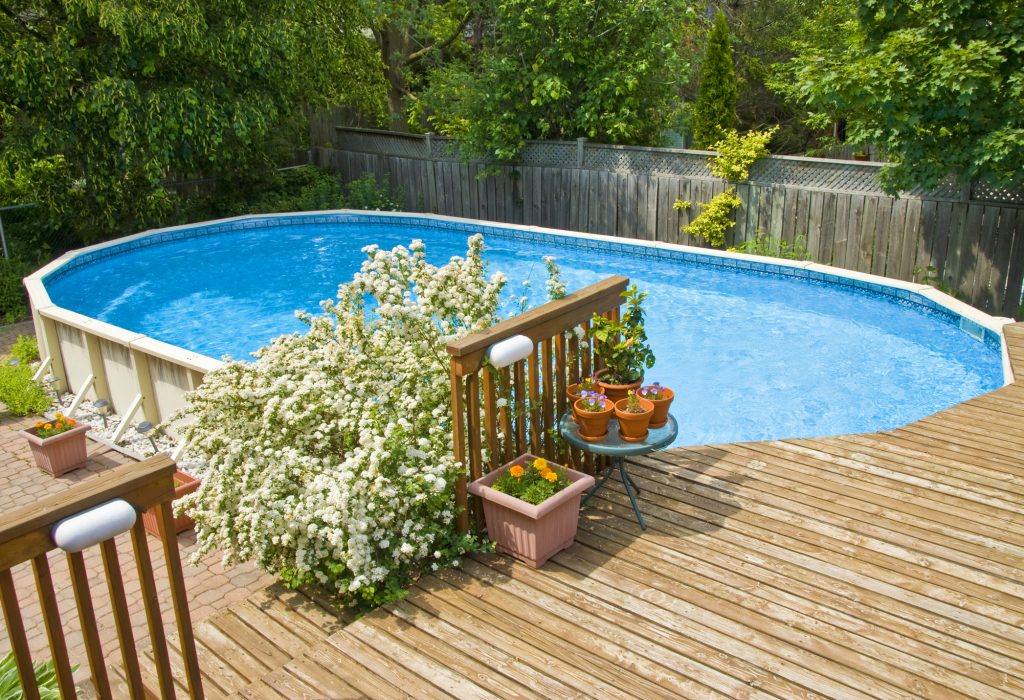 new pool, new wooden deck freshly built by construction contractors